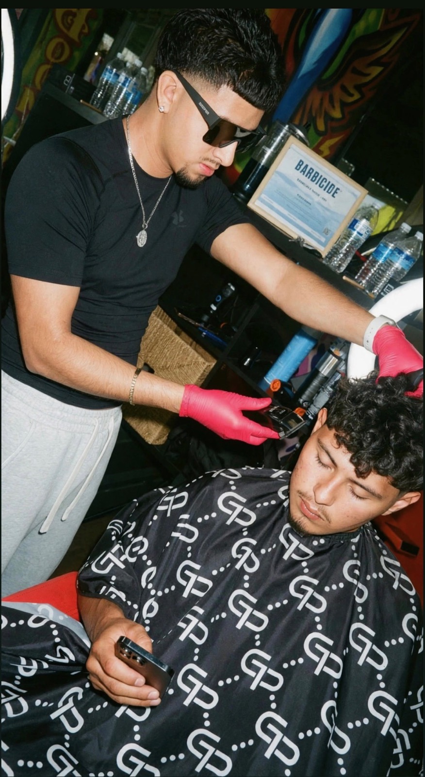 Chris, barber at Boomin' Barbershop
